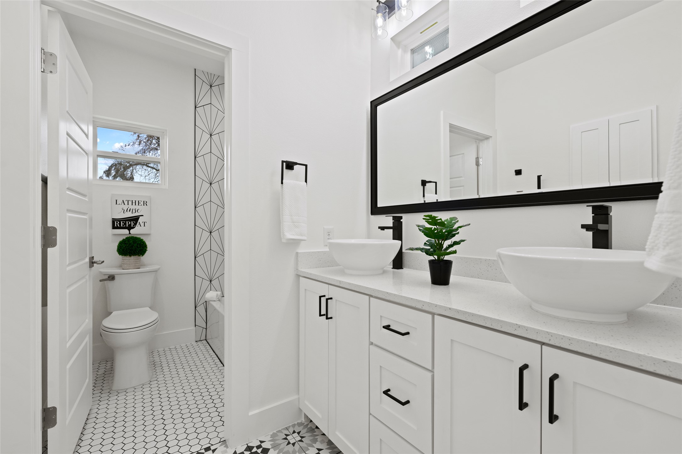 2102 East 2nd Street, Unit 2 Austin, TX 78702 - Photo 6 of 18 The full bathroom upstairs is perfect for a couple or roommates with a separate water closet.