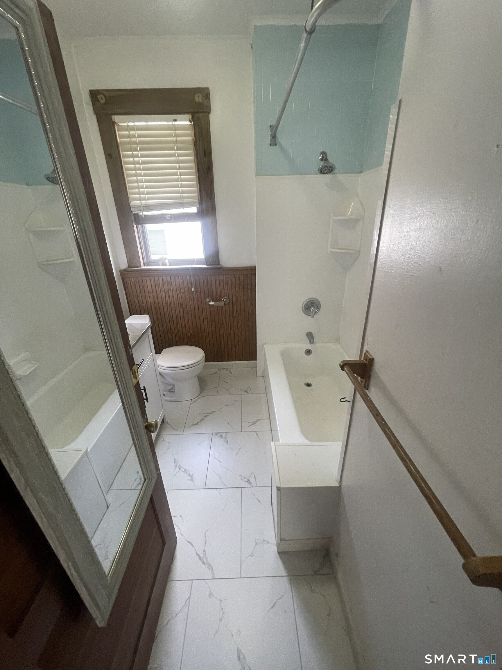 65 1st Street, Unit 2 Hamden, CT 06514 - Photo 13 of 15 a bathroom with a sink a toilet and shower