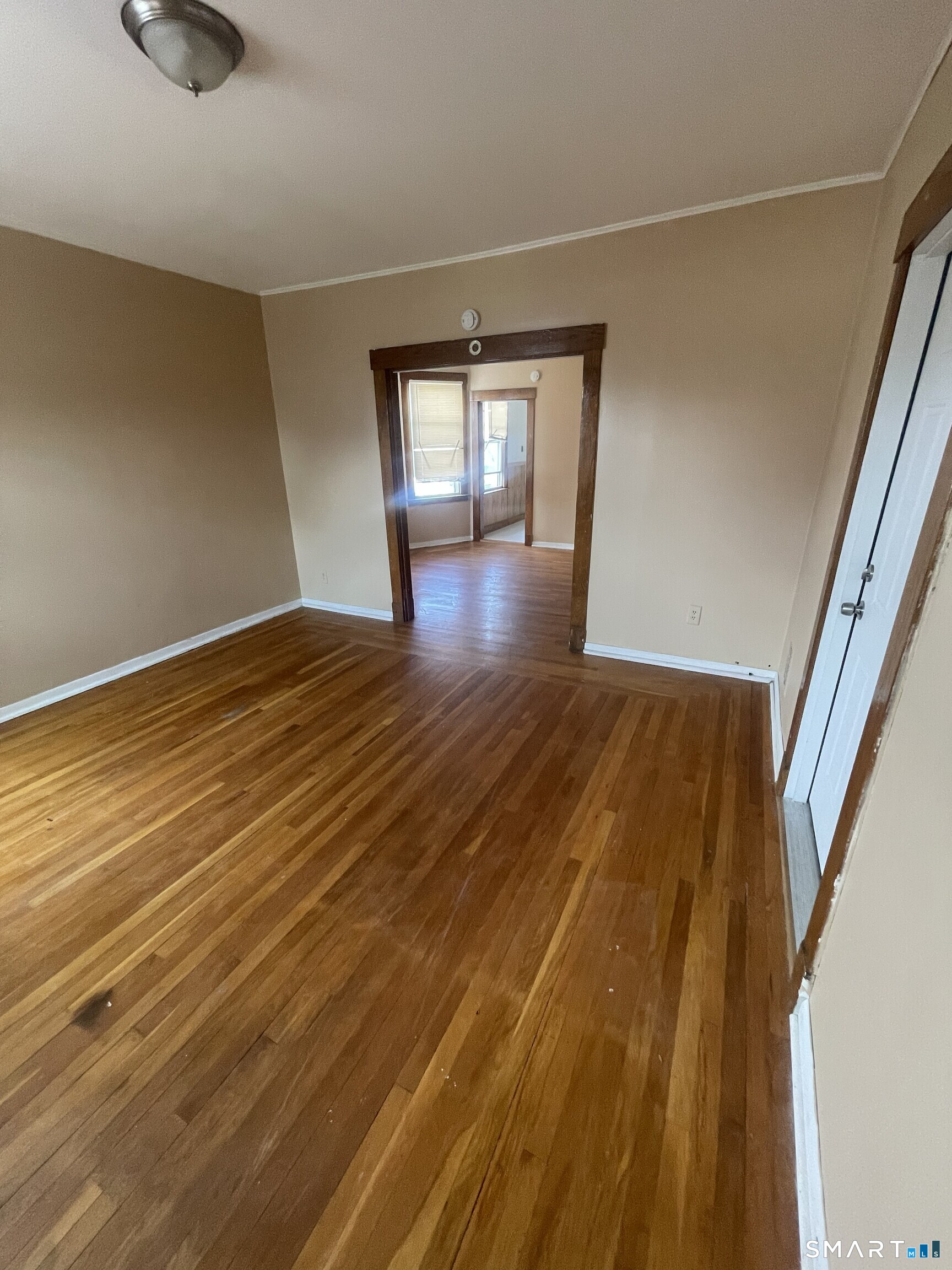 65 1st Street, Unit 2 Hamden, CT 06514 - Photo 3 of 15 wooden floor in an empty room with a window