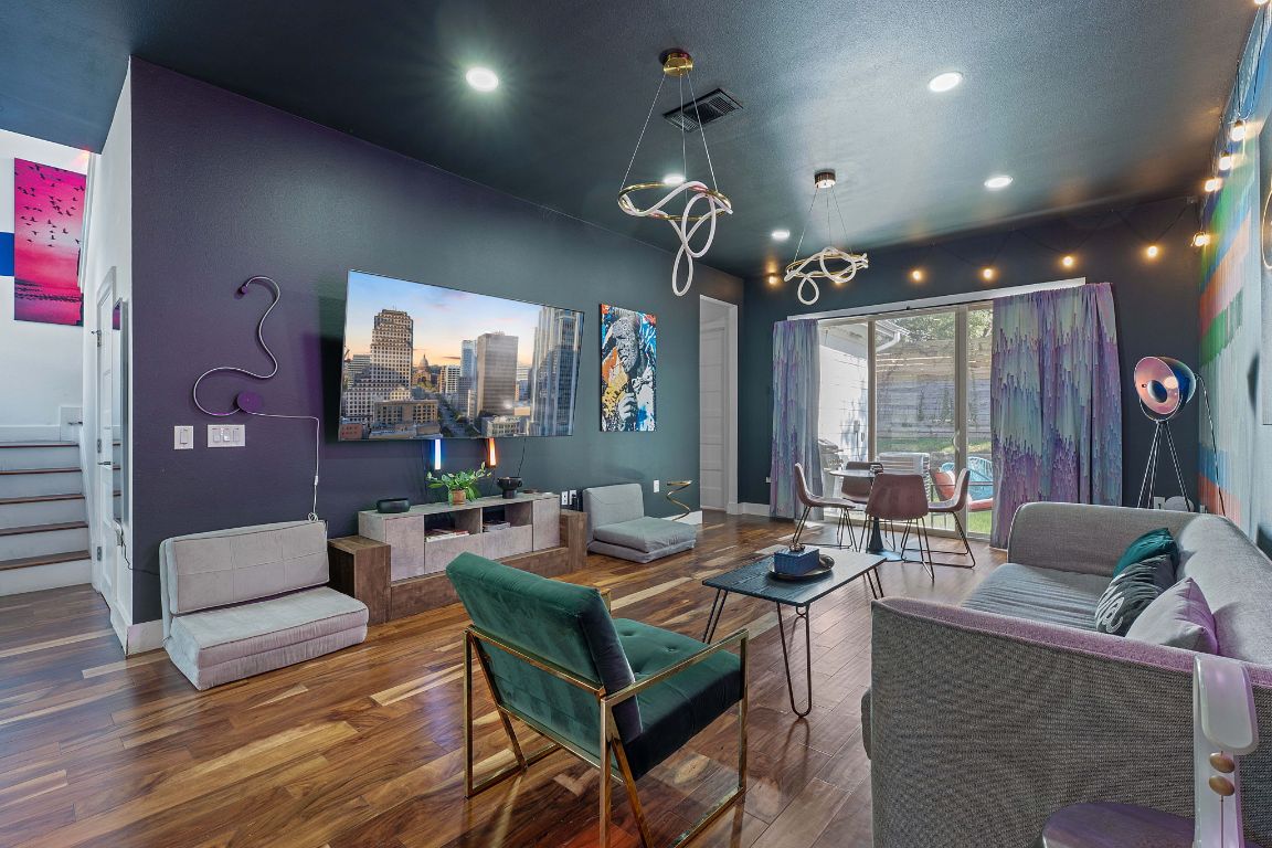 3603 East 12th Street Austin, TX 78721 - Photo 15 of 27 a living room with fireplace furniture and a large window