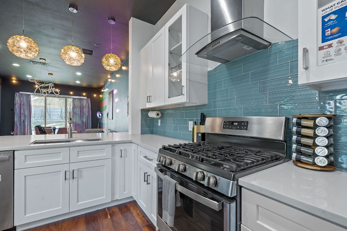 3603 East 12th Street Austin, TX 78721 - Photo 21 of 27 a white stove top oven sitting inside of a kitchen