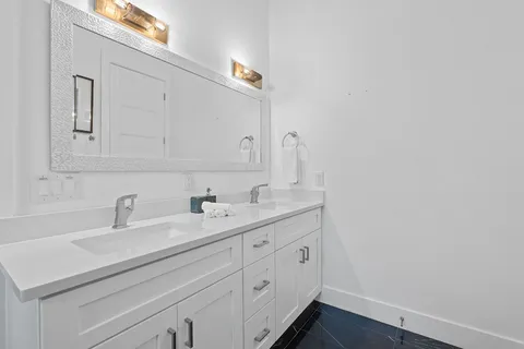 a bathroom with a sink and a mirror