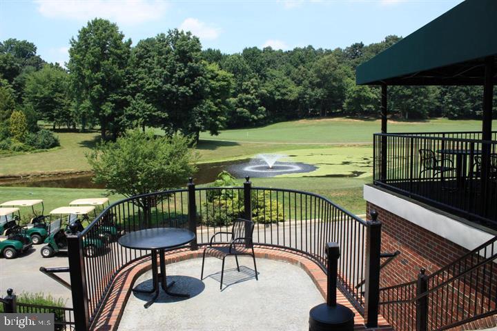 12012 Golf Ridge Court, Unit 374 Fairfax, VA 22033 - Photo 33 of 38 a view of a balcony with two chairs and a table