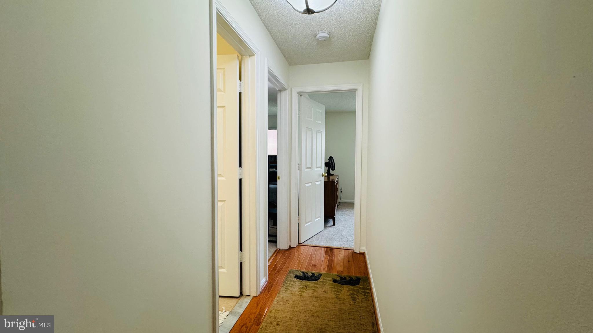12012 Golf Ridge Court, Unit 374 Fairfax, VA 22033 - Photo 9 of 38 a view of a hallway with painted walls