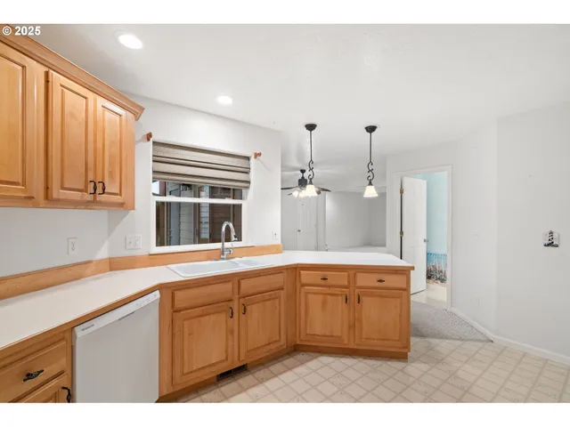 a white refrigerator freezer sitting in a kitchen