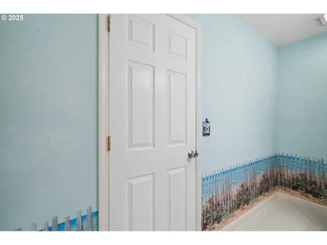a bathroom with a sink vanity granite and toilet