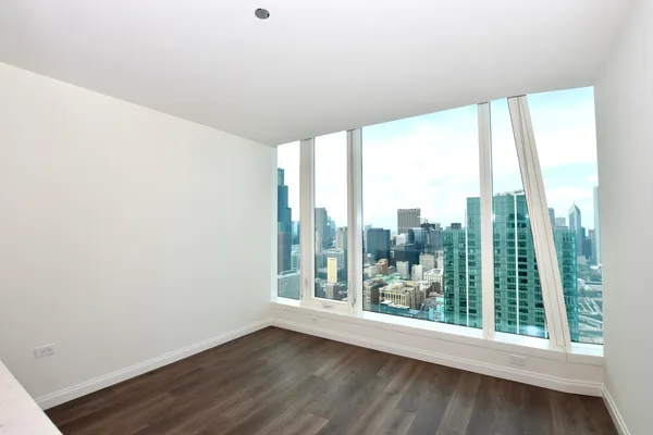 a view of a room with wooden floor and walls