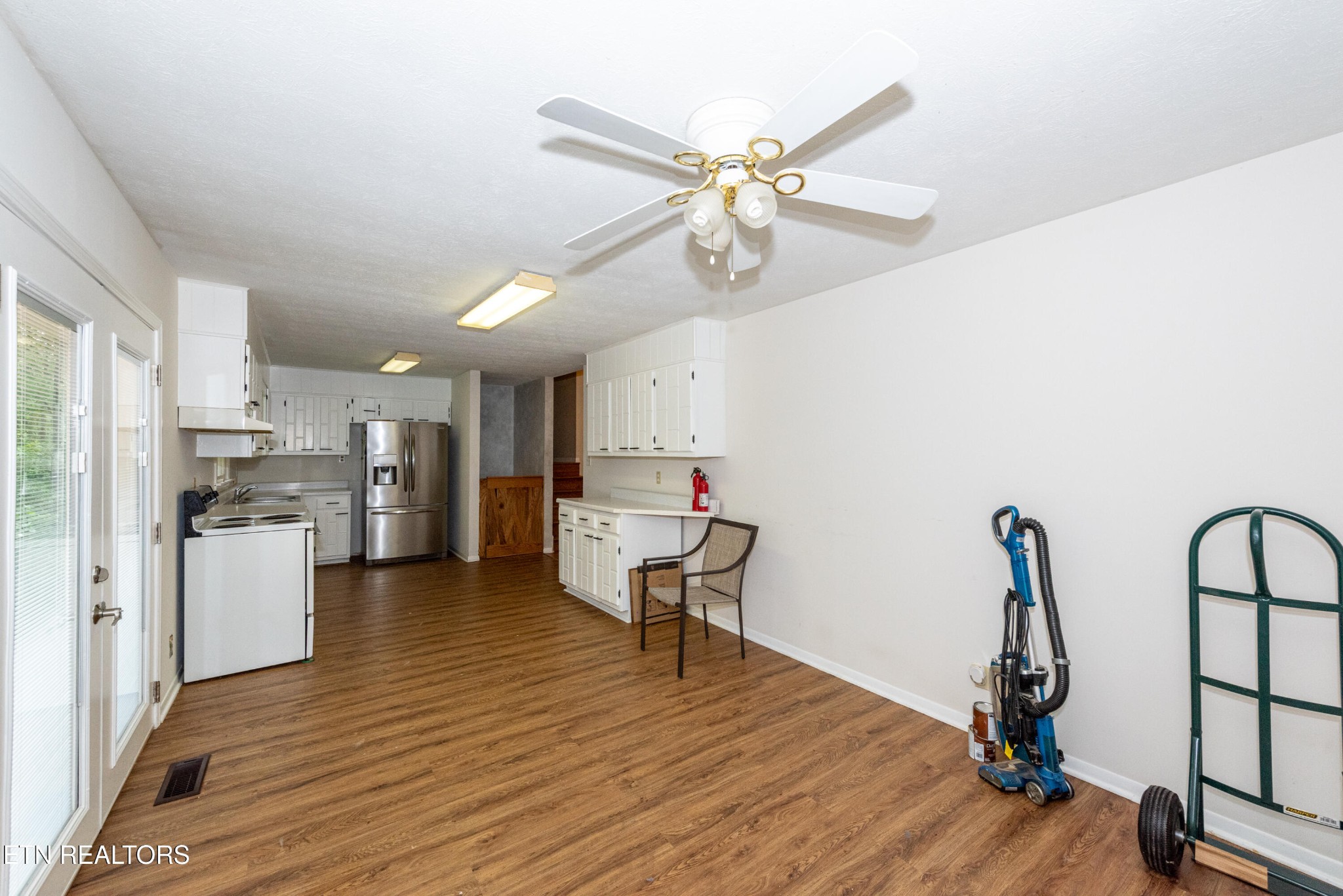 133 Windham Road Oak Ridge, TN 37830 - Photo 12 of 35 a view of a kitchen with refrigerator and wooden floor