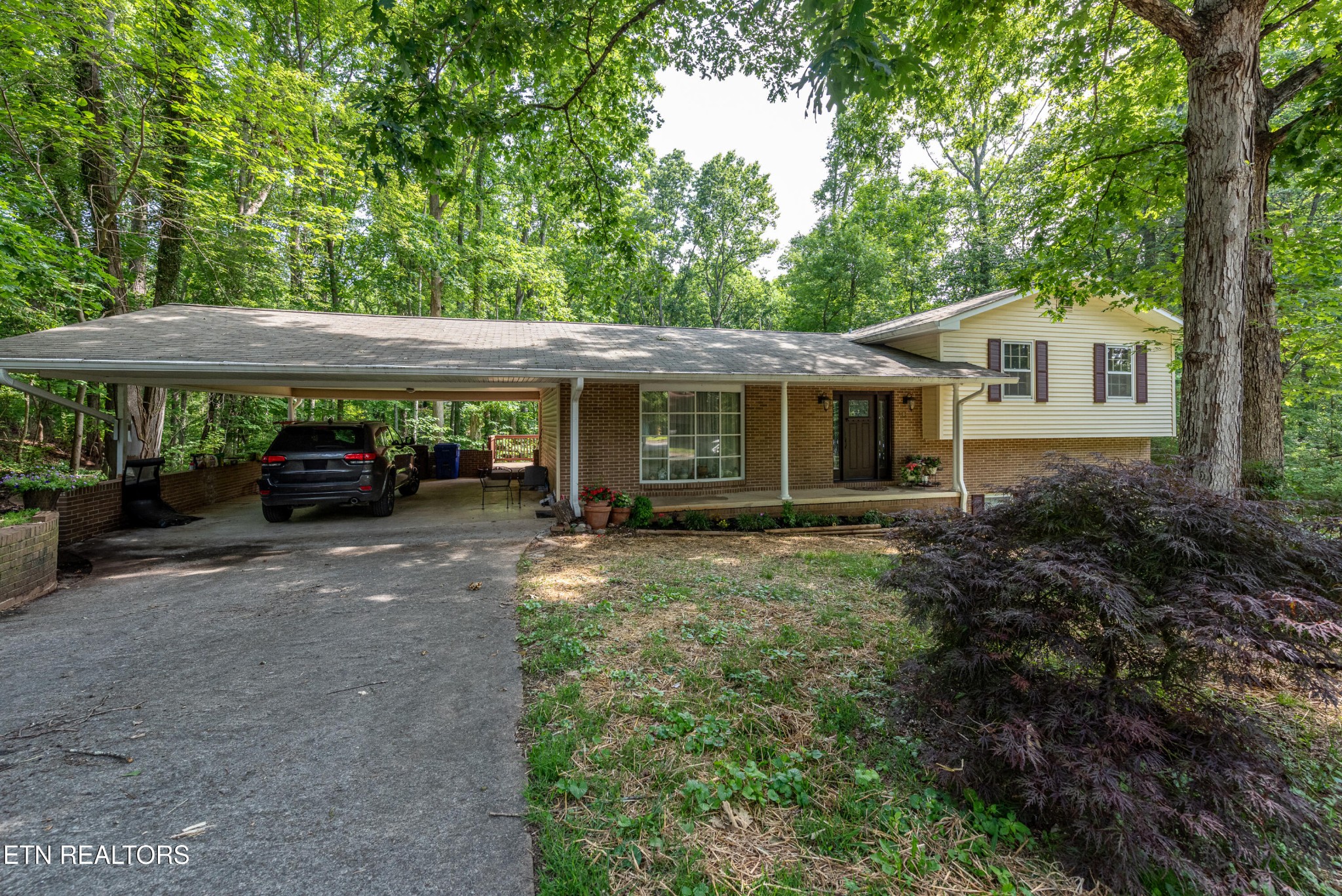 133 Windham Road Oak Ridge, TN 37830 - Photo 2 of 35 a view of a car parked in front of a house