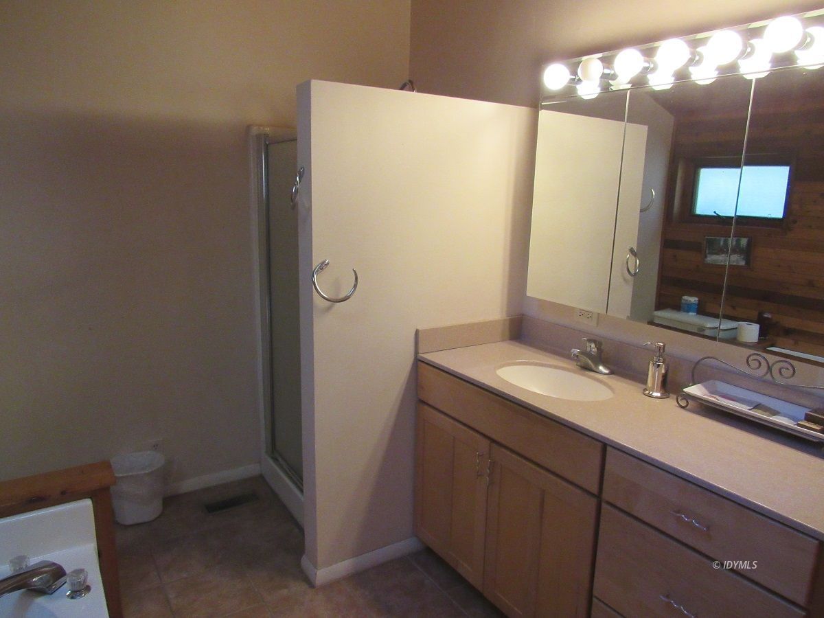 53700 Tollgate Road Idyllwild, CA 92549 - Photo 11 of 15 a bathroom with a double vanity sink toilet and mirror