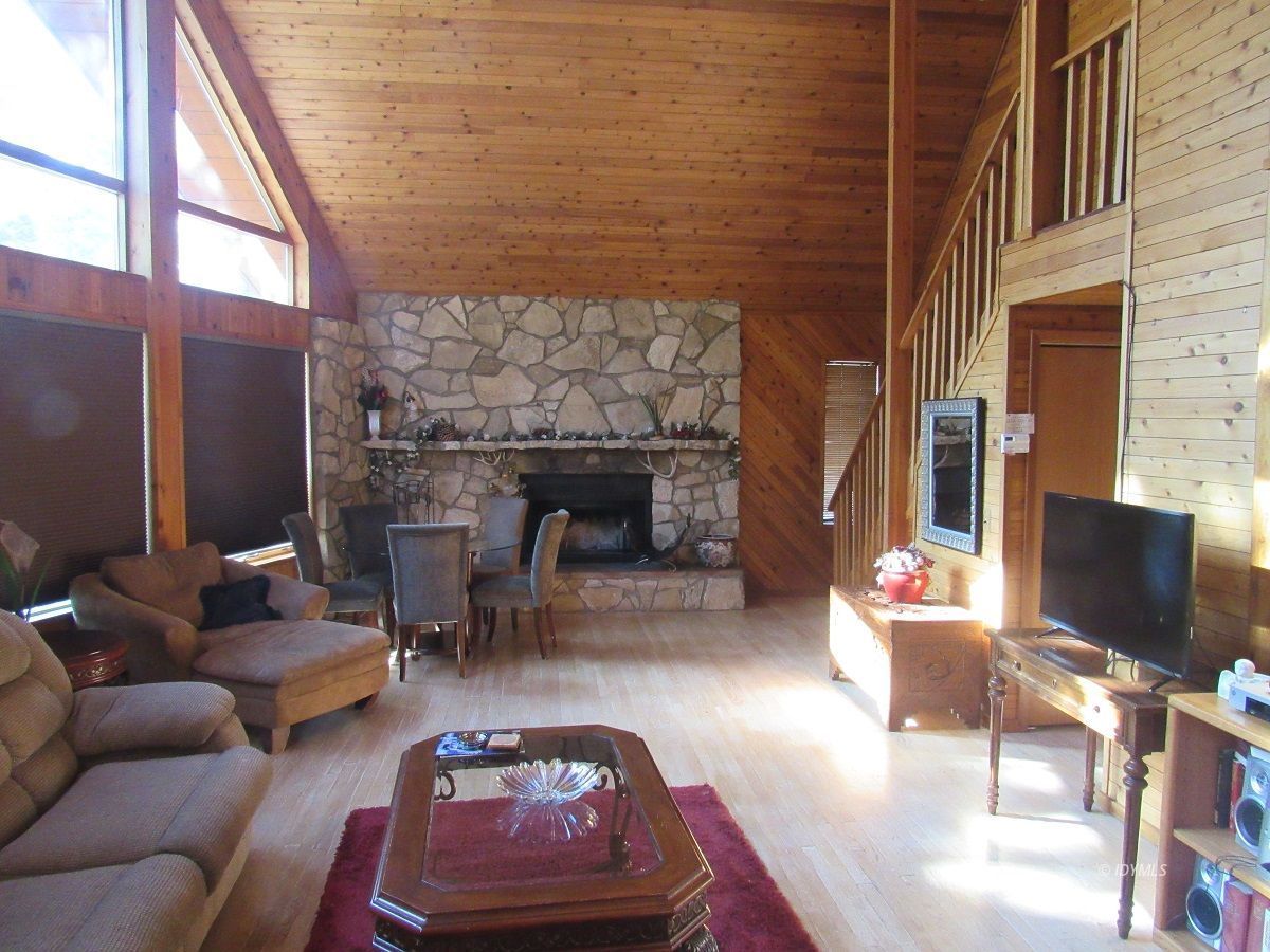 53700 Tollgate Road Idyllwild, CA 92549 - Photo 3 of 15 a outdoor space with patio the couches and a flat screen tv