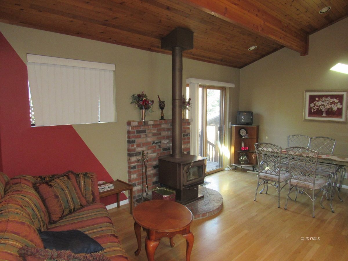 53700 Tollgate Road Idyllwild, CA 92549 - Photo 5 of 15 a living room with furniture kitchen view and a large window