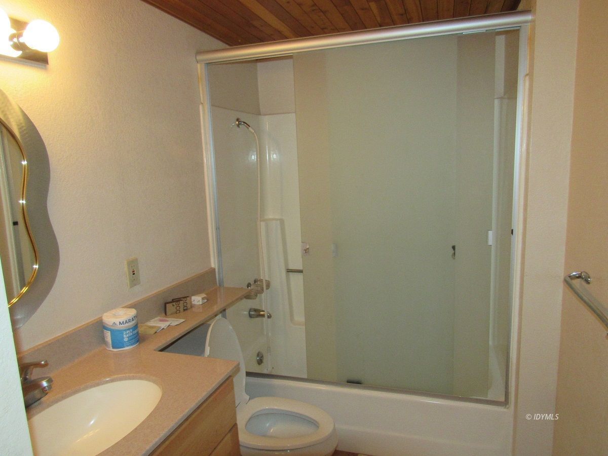 53700 Tollgate Road Idyllwild, CA 92549 - Photo 9 of 15 a bathroom with a sink and mirror with toilet