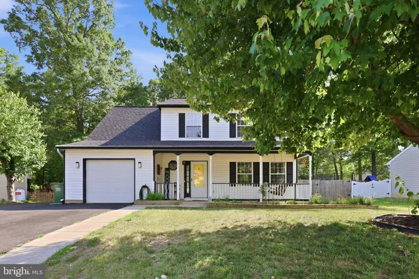 front view of a house with a garden