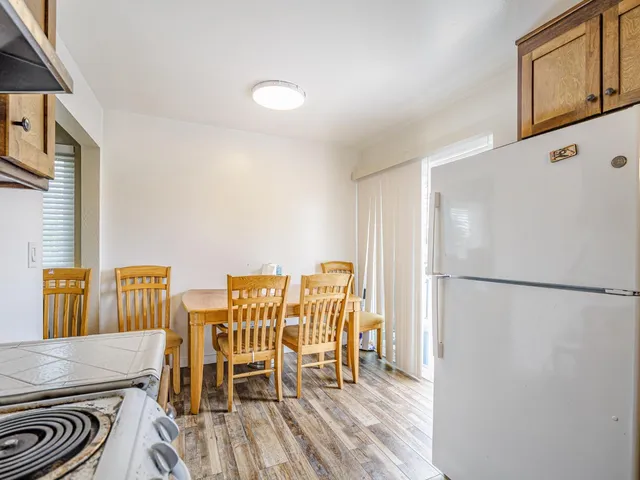 a kitchen with stainless steel appliances granite countertop a refrigerator sink and cabinets