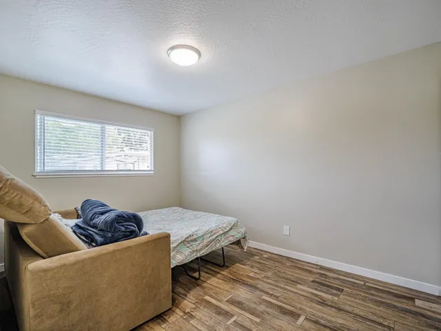 a backyard of a house with table and chairs