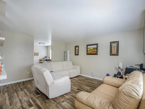 a kitchen with stainless steel appliances a stove a refrigerator a sink a stove and a refrigerator