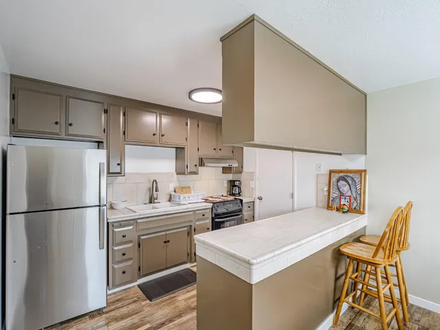 a view of a dining room with furniture and a window
