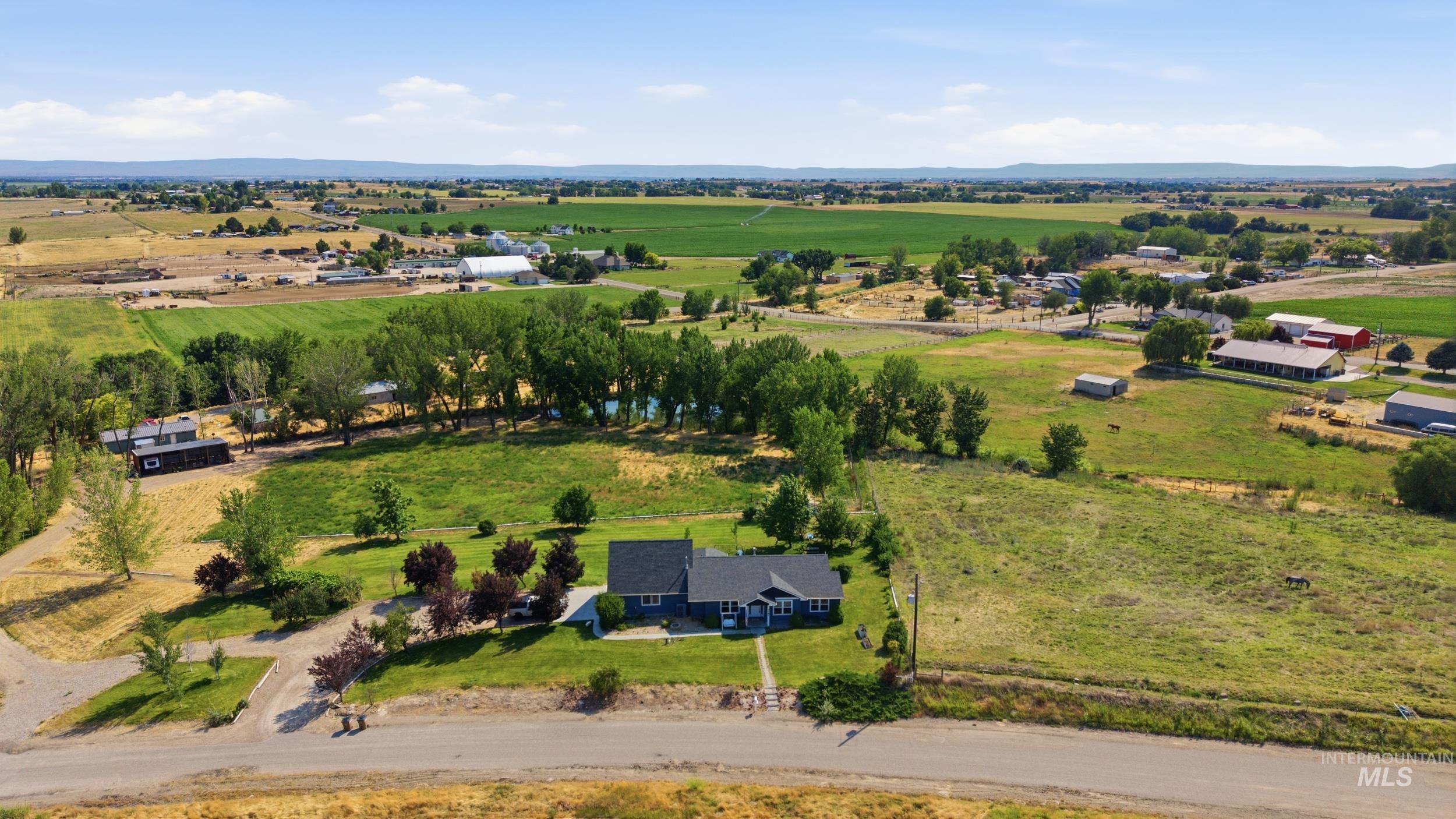 7781 Redmon Road Caldwell, ID 83607 - Photo 49 of 50 Spacious outdoor area with a vibrant green lawn
