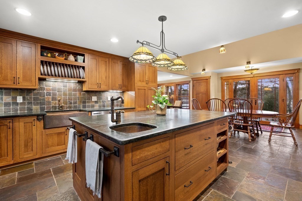 43 Boxford Road Ipswich, MA 01938 - Photo 4 of 37 a kitchen with stainless steel appliances granite countertop a sink a stove and a wooden floors