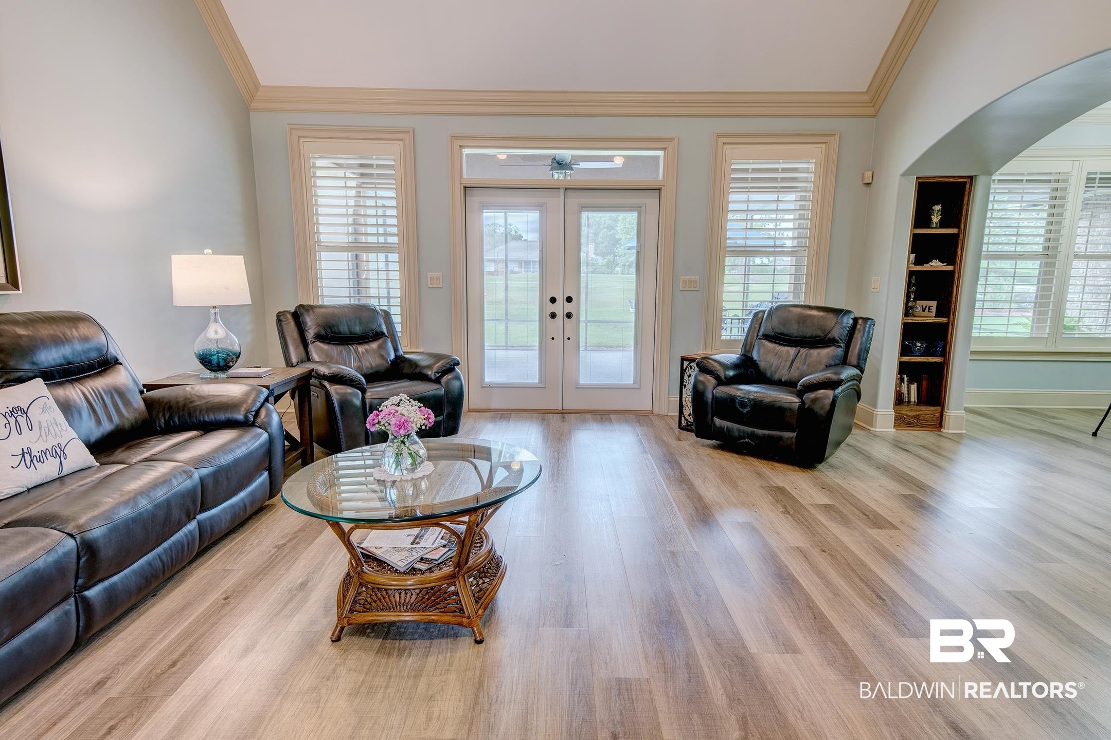 9357 Lakeview Drive Foley, AL 36535 - Photo 48 of 68 Spacious living area featuring light wood-finish flooring, a vaulted ceiling, and dual French doors with sidelights