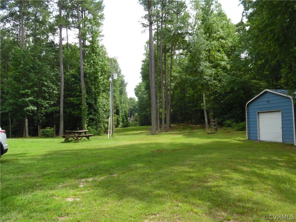 11500 Reedy Branch Road Chesterfield, VA 23838 - Photo 5 of 25 a backyard of a house with trampoline