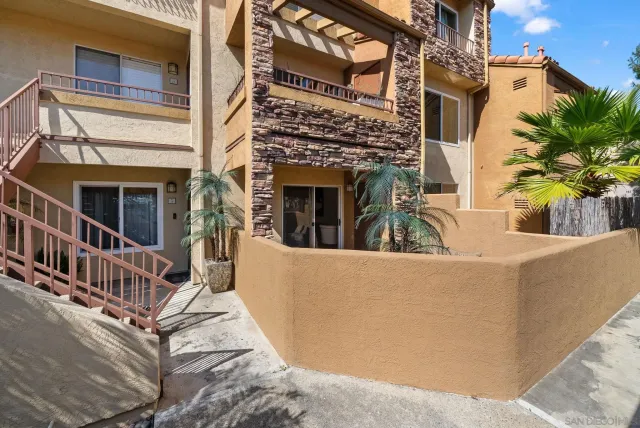 a view of a house with wooden floor and a roof deck