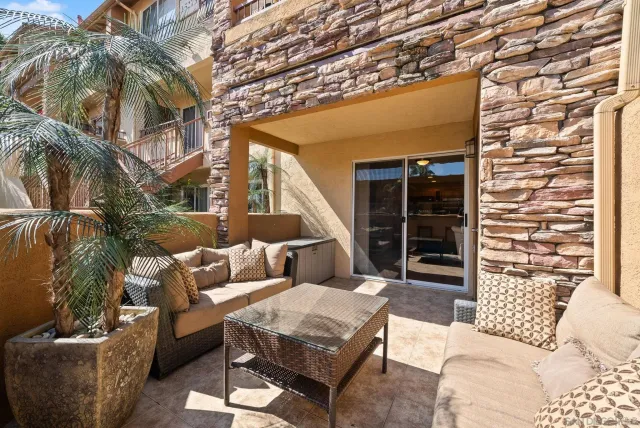 a outdoor living space with furniture and a potted plant