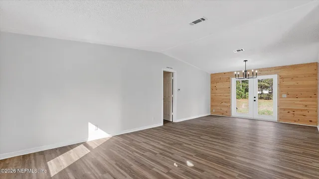 a bathroom with a shower and a mirror