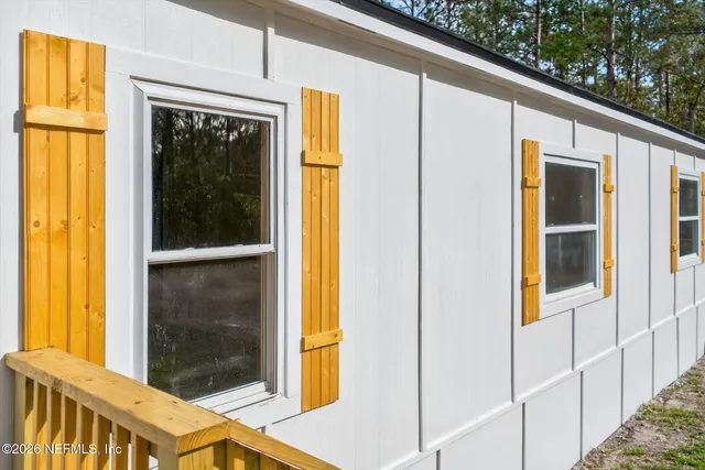 a view of a balcony with wooden floor