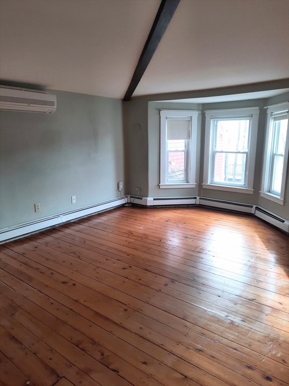 58 Main Street, Unit 2 Marshfield, MA 02050 - Photo 8 of 13 wooden floor in an empty room with a window