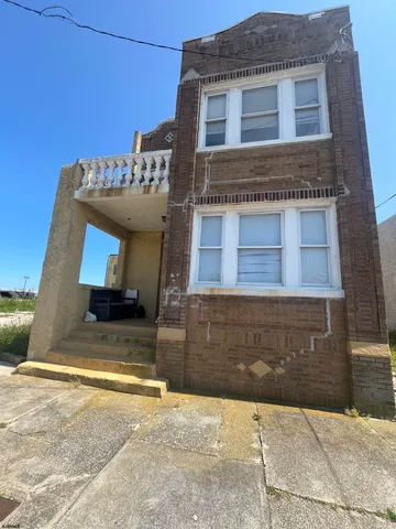 a view of a house with a street