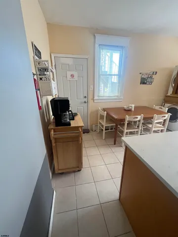 a living room with a couch and chairs