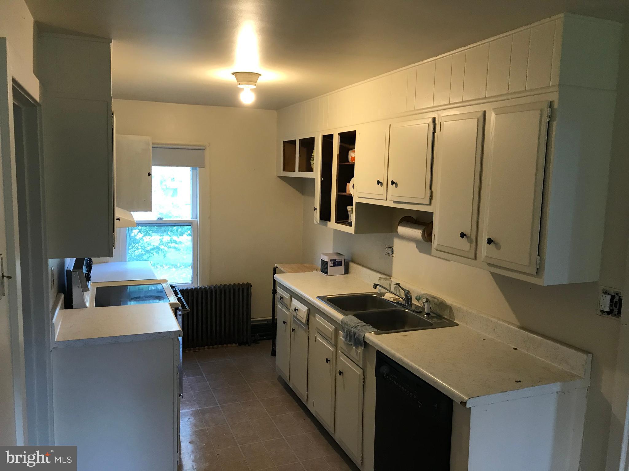 2033 Hopewell Road Oxford, PA 19363 - Photo 11 of 19 a kitchen with stainless steel appliances a sink stove and cabinets