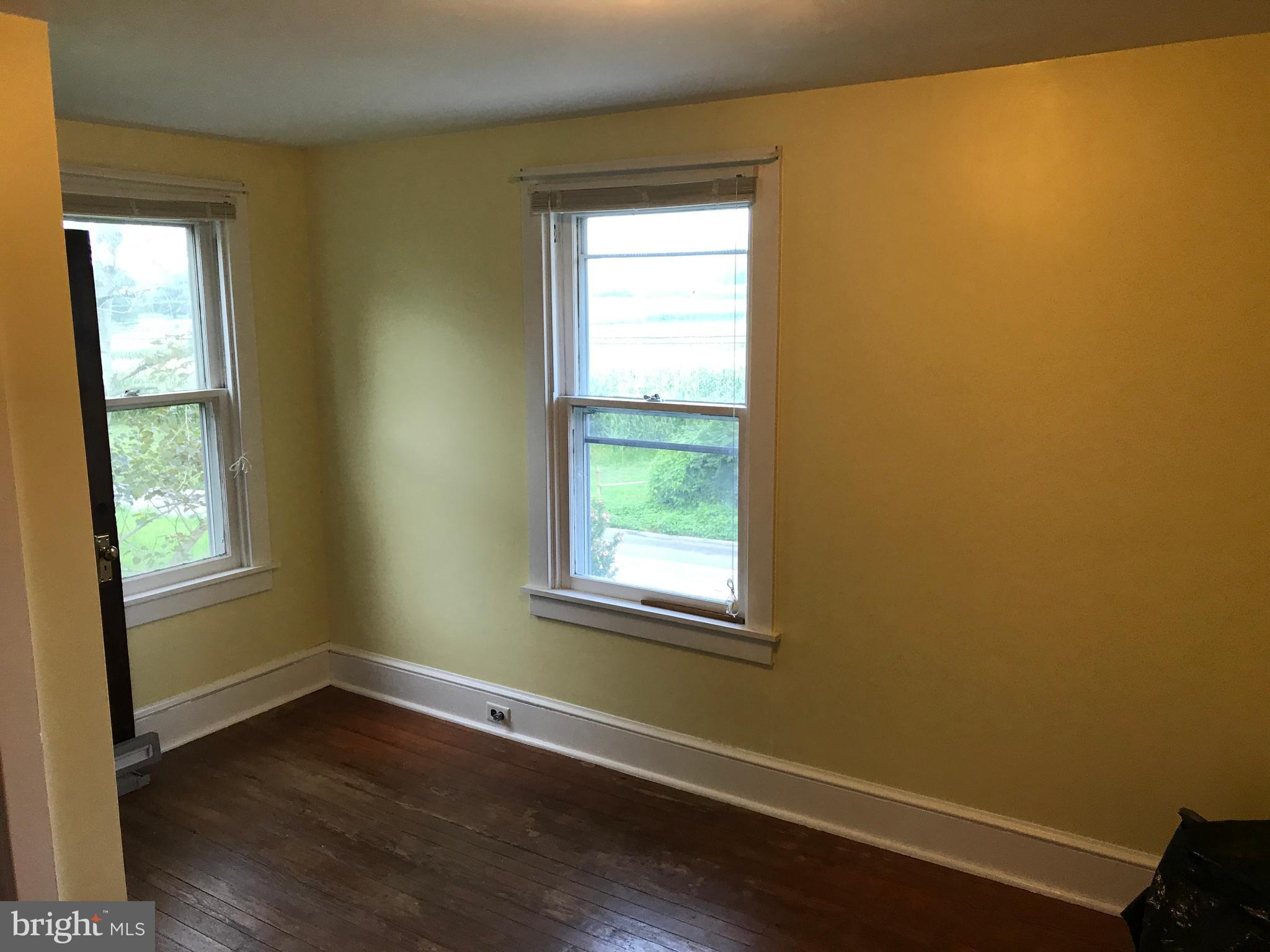 2033 Hopewell Road Oxford, PA 19363 - Photo 13 of 19 a view of an empty room with wooden floor and a window