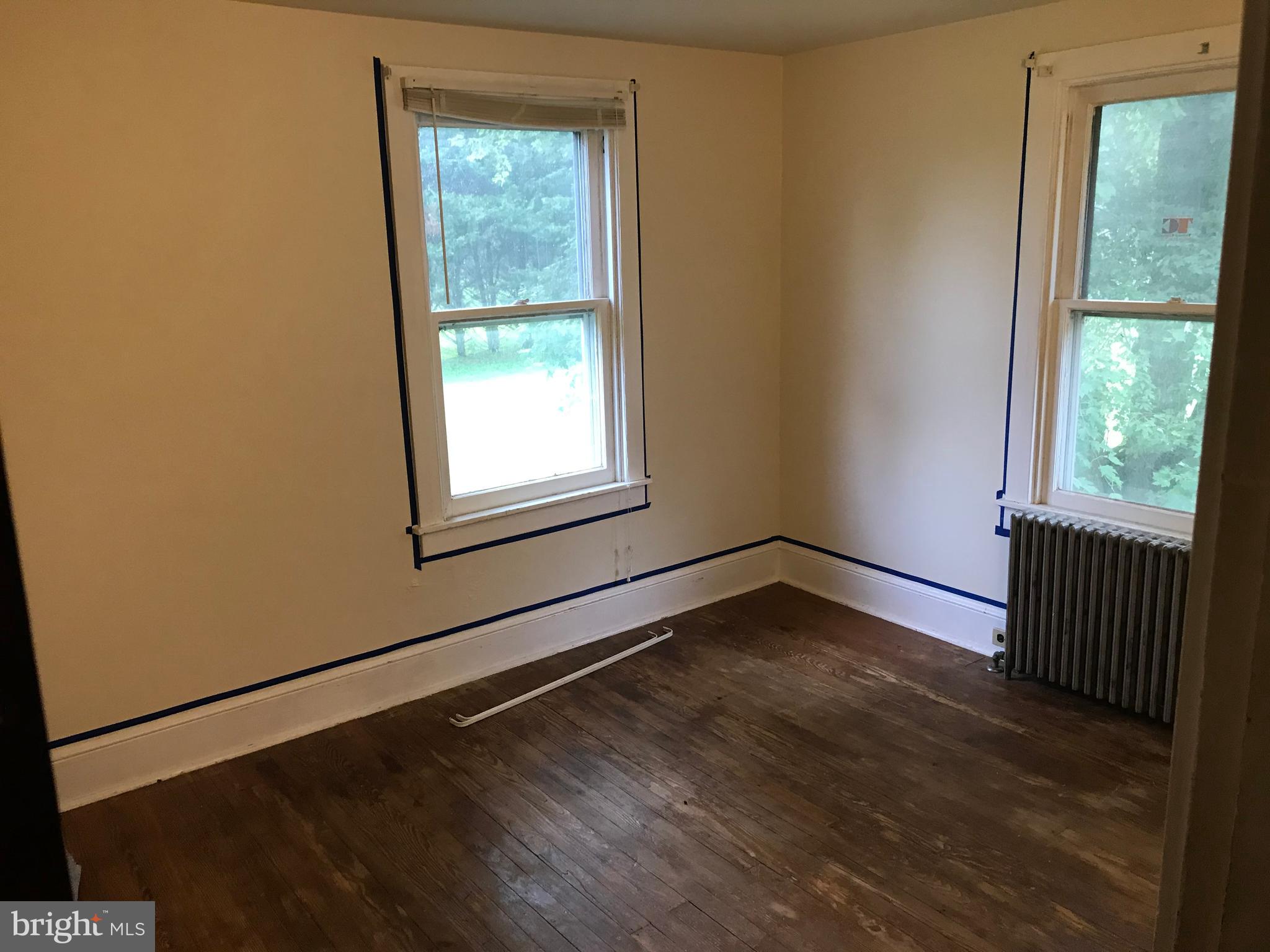 2033 Hopewell Road Oxford, PA 19363 - Photo 17 of 19 a view of an empty room with wooden floor and a window