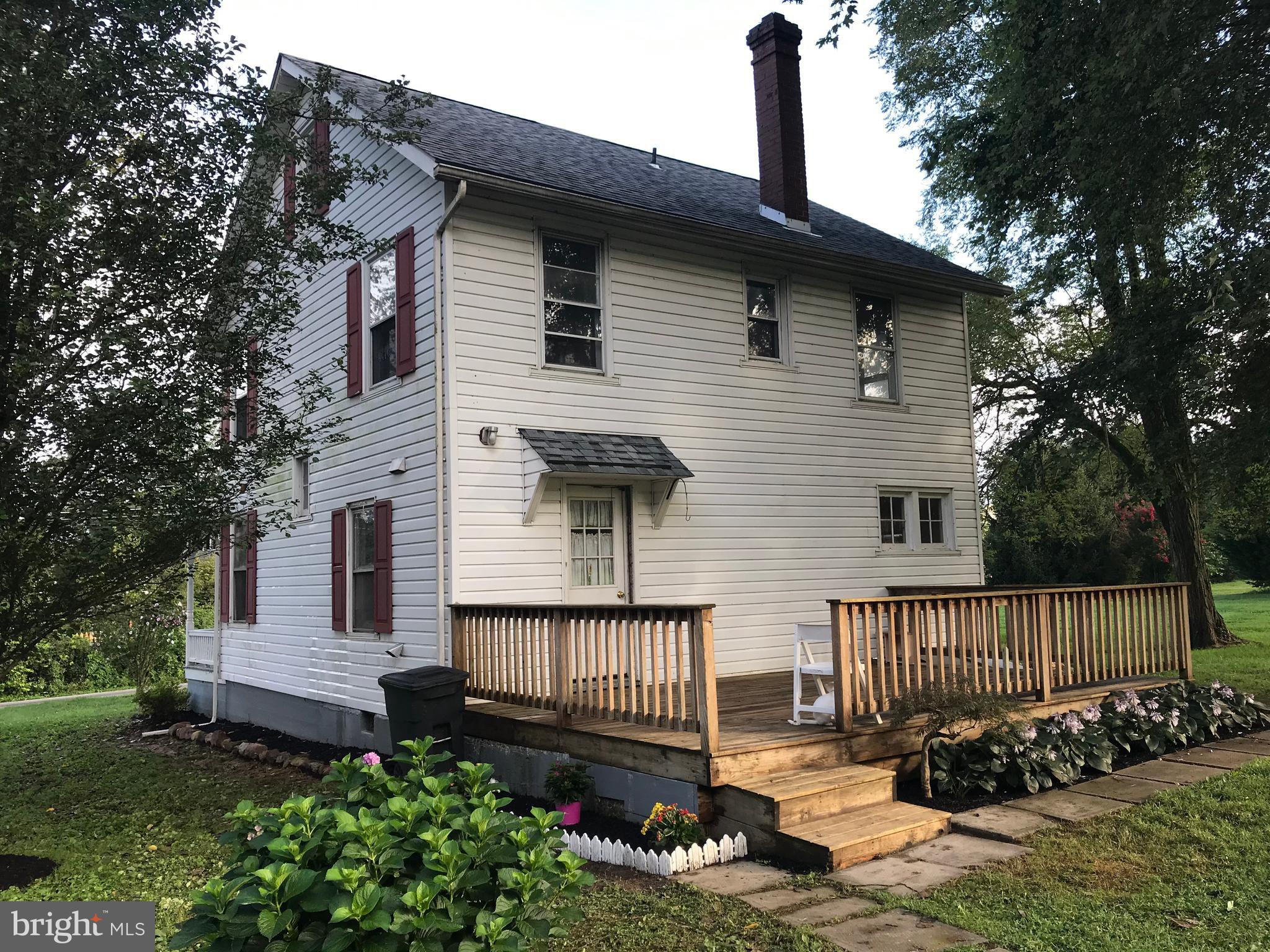2033 Hopewell Road Oxford, PA 19363 - Photo 3 of 19 a front view of a house with a garden