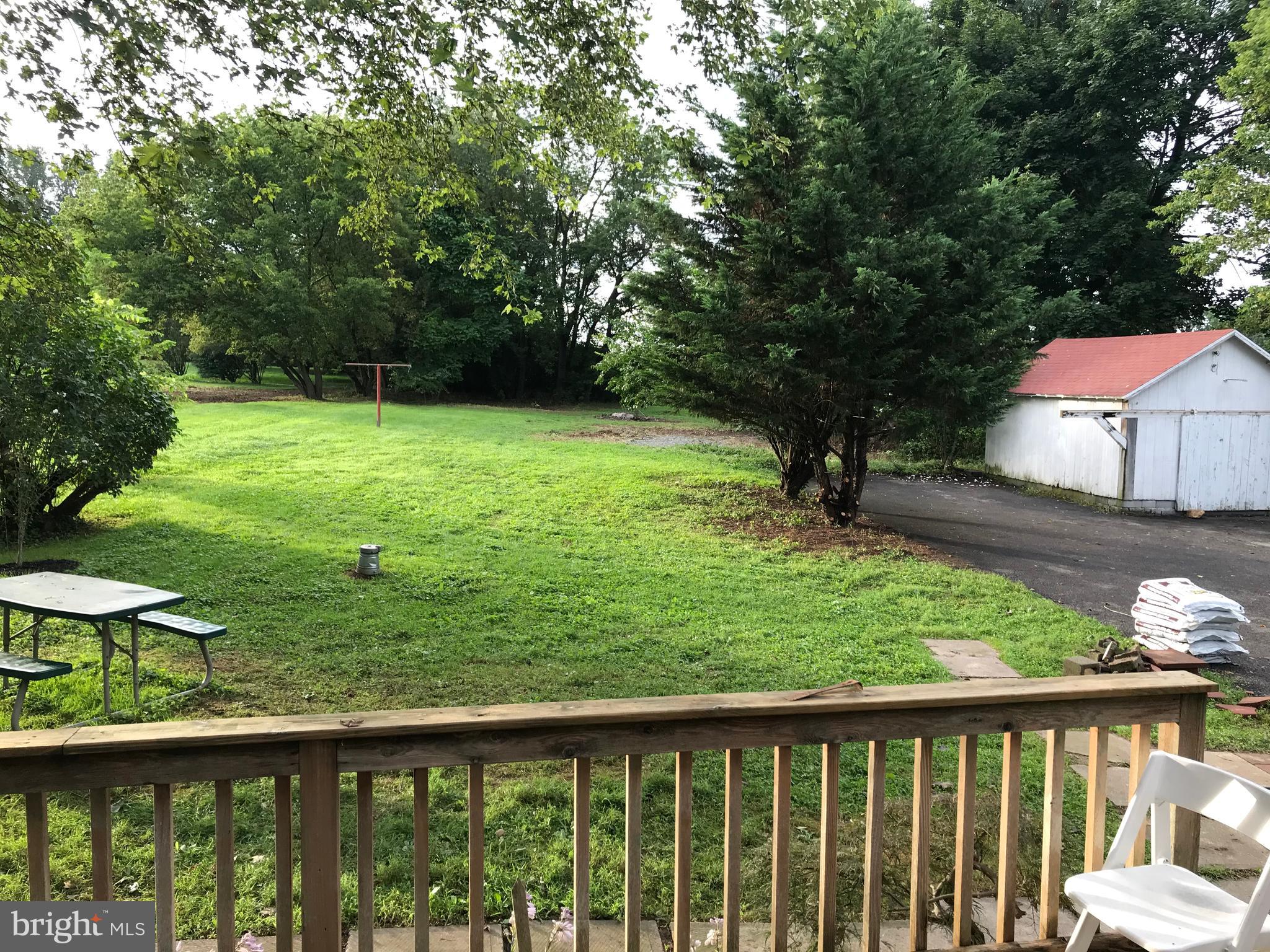 2033 Hopewell Road Oxford, PA 19363 - Photo 7 of 19 a view of a backyard with a wooden fence