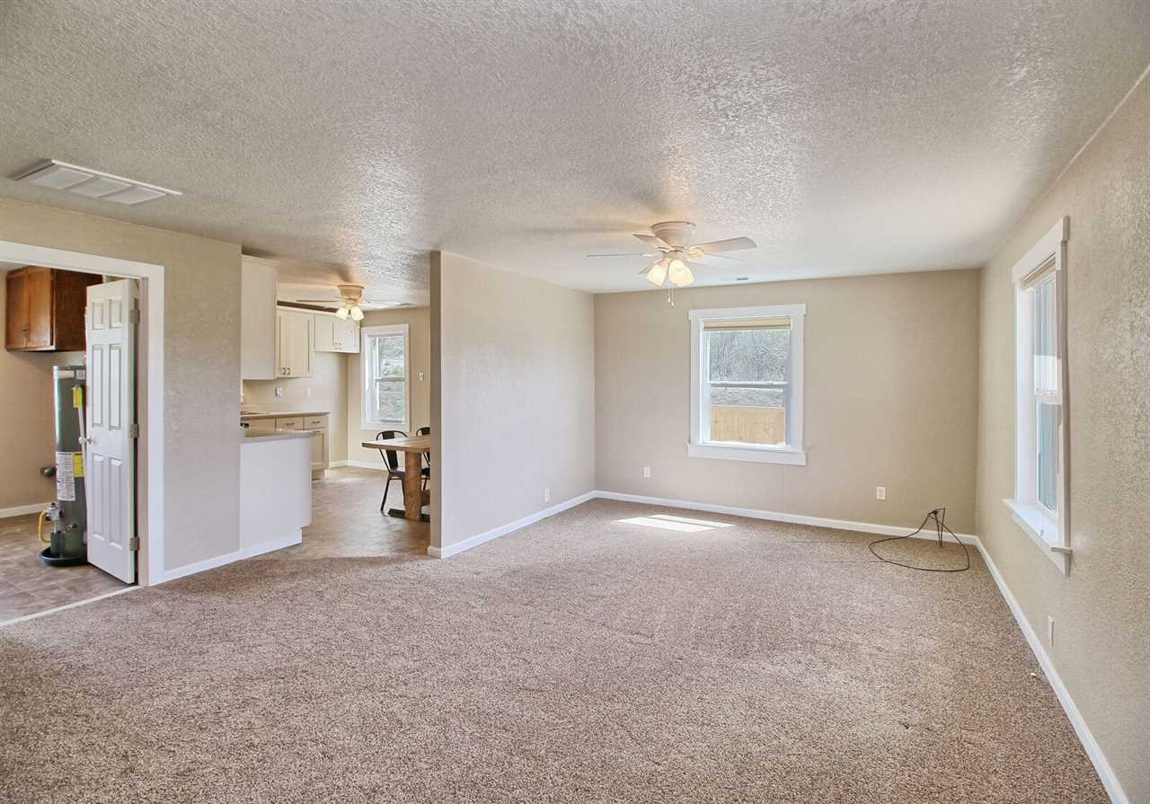 1302-17 17 1/2 Road Fruita, CO 81521 - Photo 13 of 39 an empty room with a empty space and windows