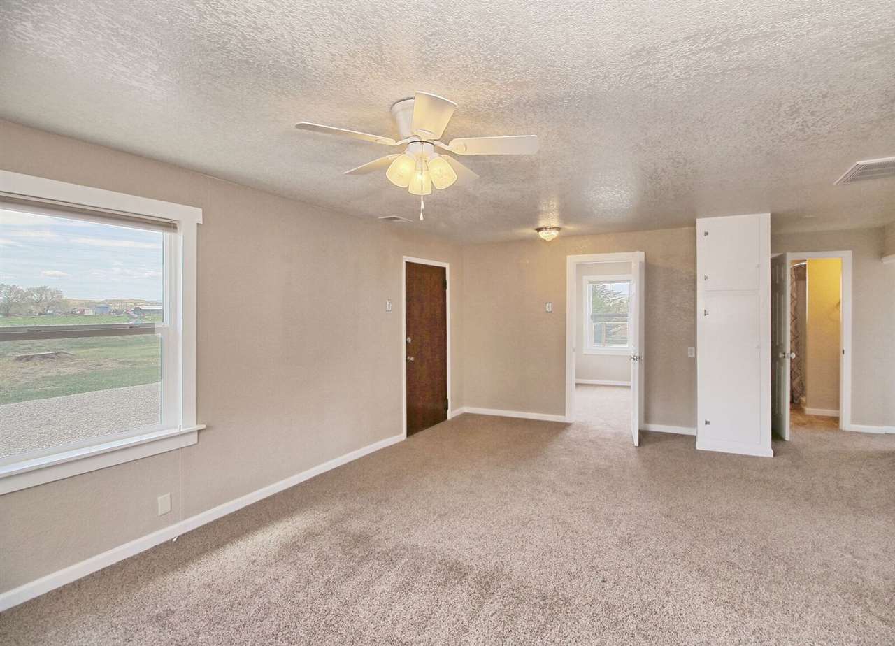 1302-17 17 1/2 Road Fruita, CO 81521 - Photo 15 of 39 a view of an empty room with a window
