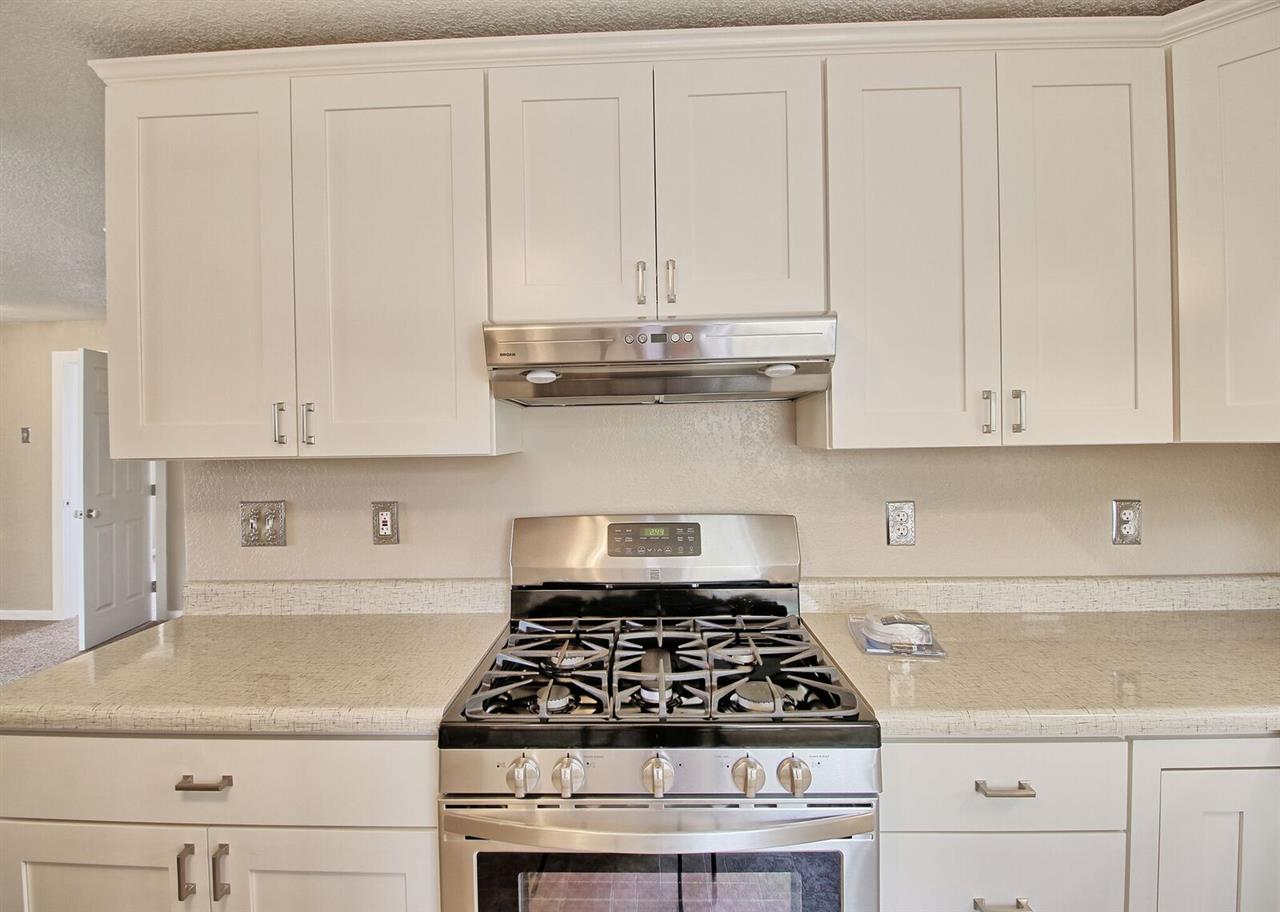 1302-17 17 1/2 Road Fruita, CO 81521 - Photo 18 of 39 a stove top oven sitting inside of a kitchen