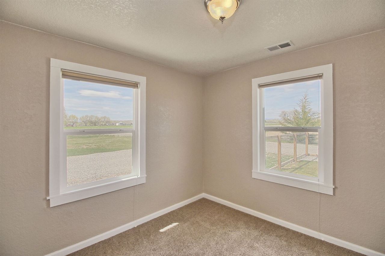 1302-17 17 1/2 Road Fruita, CO 81521 - Photo 20 of 39 a view of an empty room with a window