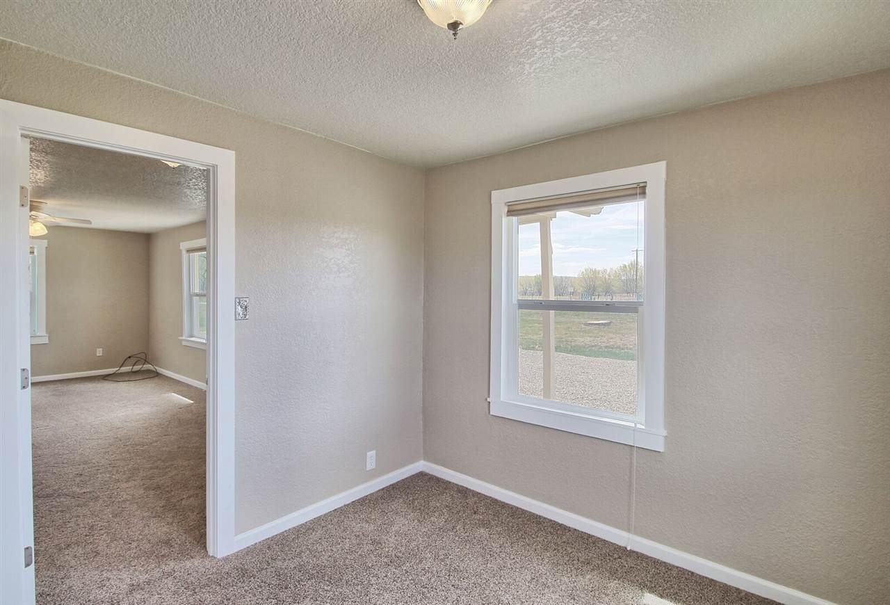 1302-17 17 1/2 Road Fruita, CO 81521 - Photo 22 of 39 an empty room with windows