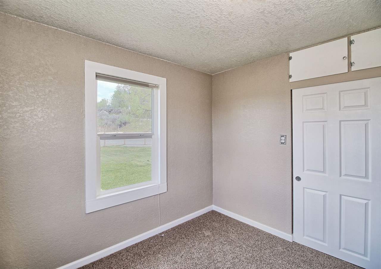 1302-17 17 1/2 Road Fruita, CO 81521 - Photo 25 of 39 an empty room with windows
