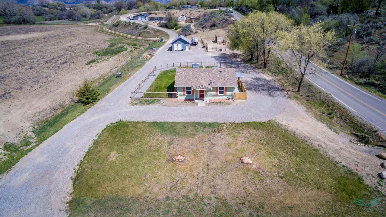 1302-17 17 1/2 Road Fruita, CO 81521 - Photo 37 of 39 an aerial view of a house with a swimming pool