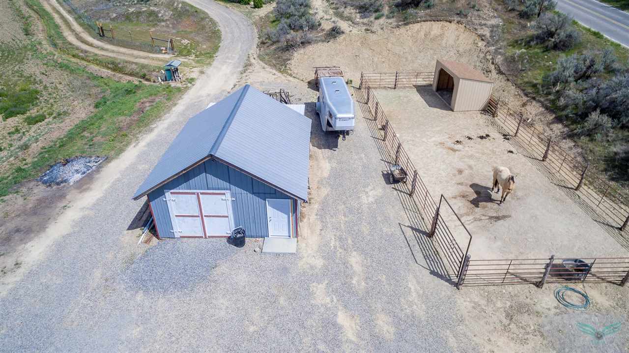 1302-17 17 1/2 Road Fruita, CO 81521 - Photo 38 of 39 an aerial view of a house with swimming pool and large trees