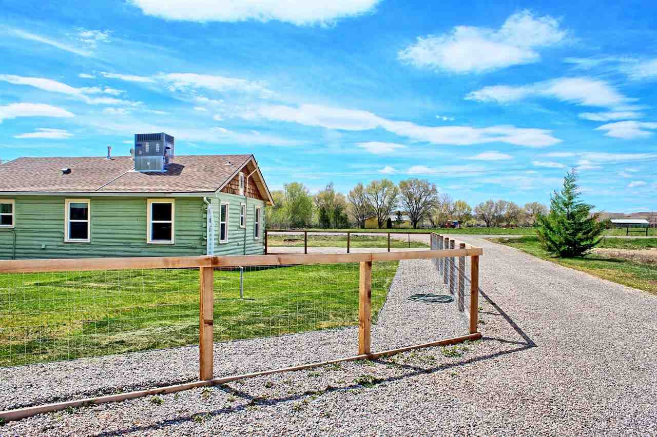 1302-17 17 1/2 Road Fruita, CO 81521 - Photo 10 of 39 a view of a house with a yard