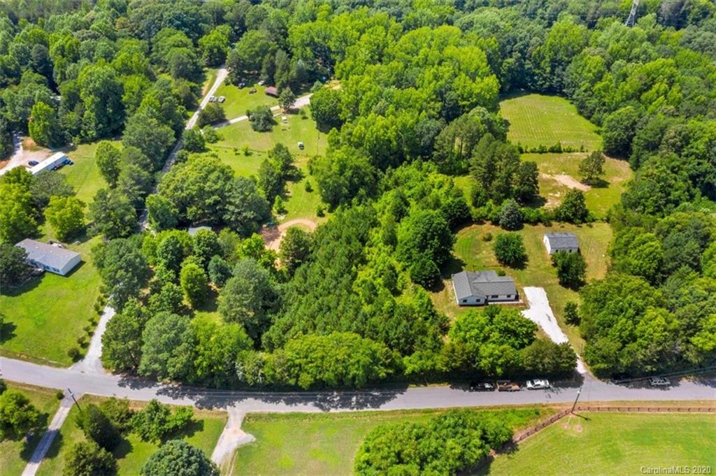 1.55-acres Pamela Road York, SC 29745 - Photo 1 of 4 an aerial view of a house with swimming pool and large trees