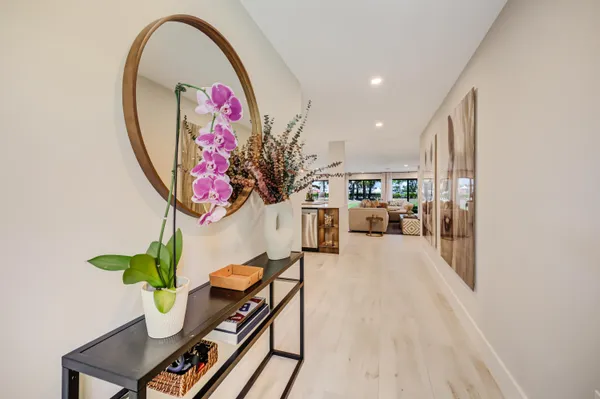 a kitchen with stainless steel appliances kitchen island granite countertop a refrigerator and a sink