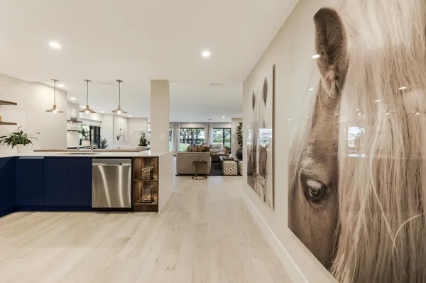 a kitchen with stainless steel appliances a sink and cabinets
